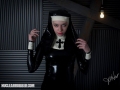 bizarre latex fetish nun in high heels and rubber hood