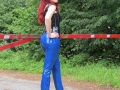 redhead in latex pants walking on public road in high heels